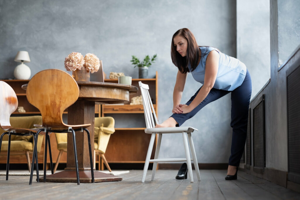 female office worker stand in yoga pose stretching DH7FNHF