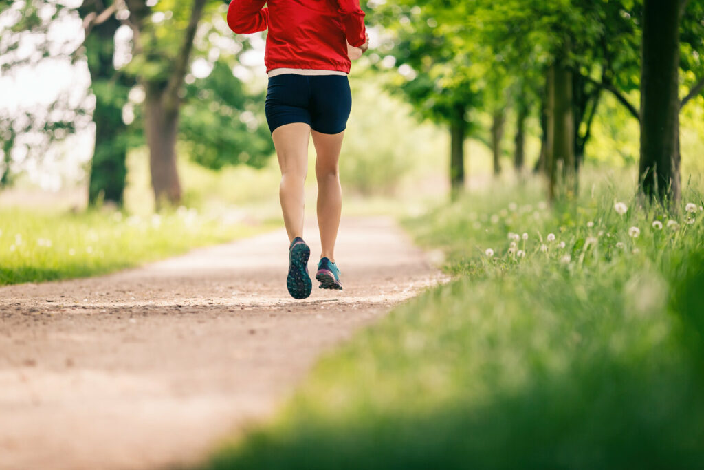 running woman enjoying summer day in park 3HVMGNQ 1