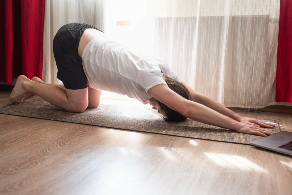 stretching spine asana young caucasian man practic JUM6EKF