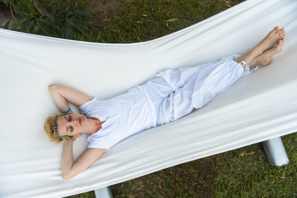 young woman resting on hammock Q2Z37B8